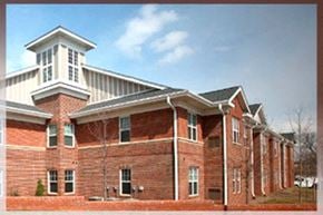 Raleigh townhouse for rent - A red brick building with a white cupola on top.