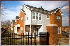 Raleigh townhouse for rent - A house with a black fence in front.