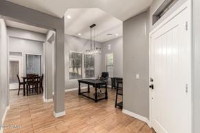 Buckeye house for rent - A dining room with a table and chairs.
