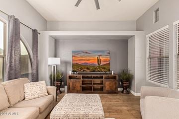 Buckeye house for rent - A living room with a large painting on the wall and a rug on the floor.