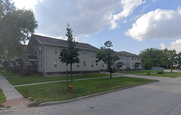 Fargo apartment for rent - A residential street with houses and a red fire hydrant.