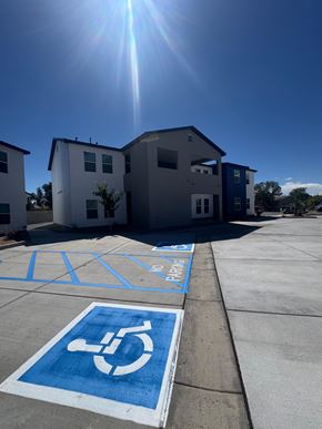 Rio Rancho apartment for rent - A sunny day at a parking lot with a handicap parking space.