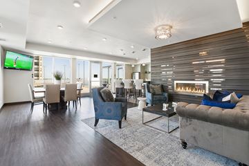 Eagan apartment for rent - A modern living room with a television and a fireplace.