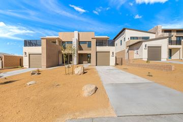 Desert Hot Springs apartment for rent - A modern house with a concrete driveway in front.