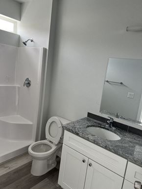 Umatilla apartment for rent - A white toilet sits next to a sink in a bathroom.