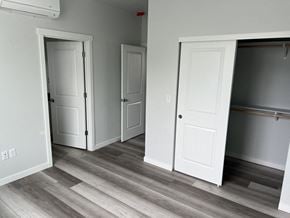 Umatilla apartment for rent - A room with white doors and a wooden floor.