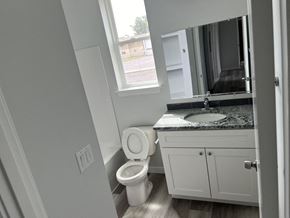 Umatilla apartment for rent - A bathroom with a toilet, sink, and cabinet.
