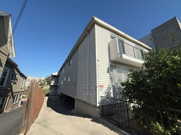 Los Angeles apartment for rent - A white house with a black fence in front of it.