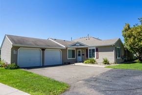 White Bear Lake apartment for rent - A house with a grey roof and two garages.