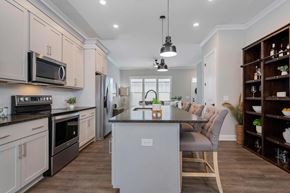 Lewis Center apartment for rent - A modern kitchen with a center island and a dining area.