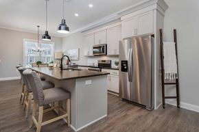 Lewis Center apartment for rent - A modern kitchen with a large island and stainless steel appliances.