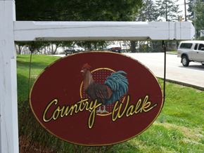 Camp Hill apartment for rent - A sign that says "Country Walk" with a picture of a rooster on it.