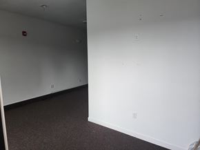 Monmouth apartment for rent - A white wall with a fire alarm on it.