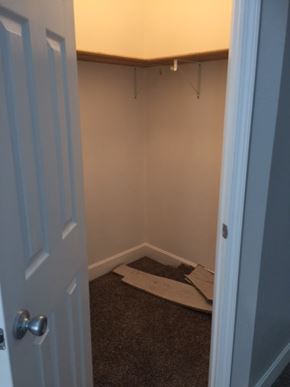 Clinton house for rent - A white door is open to a room with a carpet on the floor.