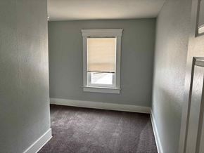 Akron apartment for rent - A room with a window covered by blinds.