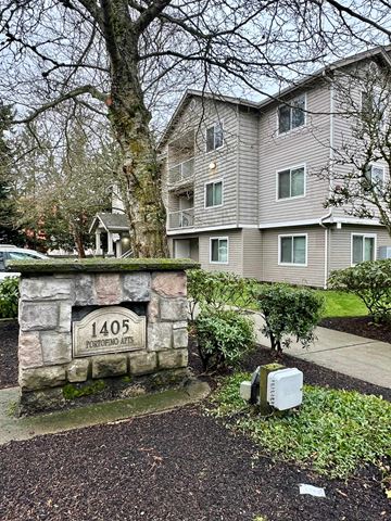 Federal Way apartment for rent - A stone wall with a plaque that reads 1405 Apartments.