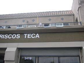 Los Angeles apartment for rent - A building with a sign that says "RISCOS TECA" on it.