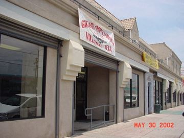 Los Angeles apartment for rent - A building with a sign that says Grand Opening on it.