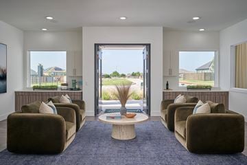 Hutto apartment for rent - A living room with brown couches and a large window.