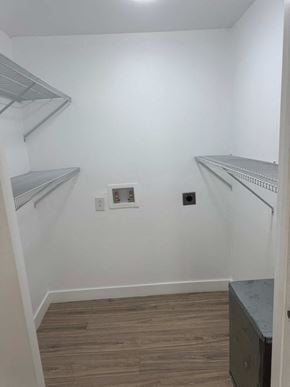 Polkton house for rent - A small room with a wooden floor and metal shelves on the walls.