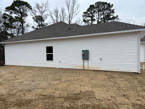 Benton house for rent - A white barn with a grey roof and a grey door.