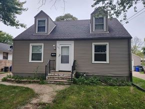 Rockford house for rent - A small house with a white door and two windows.