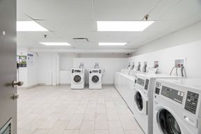 London apartment for rent - A row of washing machines in a laundromat.