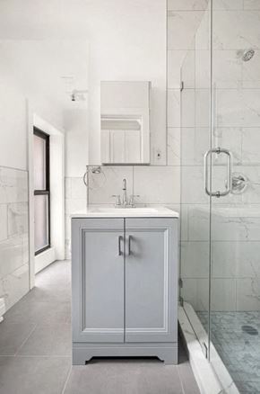 New York apartment for rent - A white cabinet with a sink is in a bathroom.