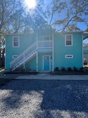 St. Augustine apartment for rent - A blue house with a white door and a small porch.