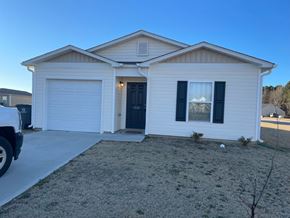 Rocky Mount house for rent - A two-story house with a garage and a driveway.