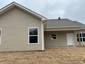 Benton house for rent - A house with a brown roof and a white door.