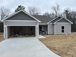 Benton house for rent - A two-story house with a garage is shown.