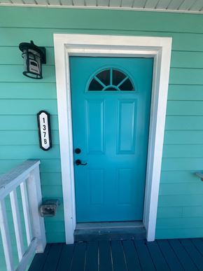 St. Augustine apartment for rent - A blue door with a mailbox and number 137 on the wall.