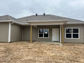 Benton house for rent - A house with a grey roof and a white door.