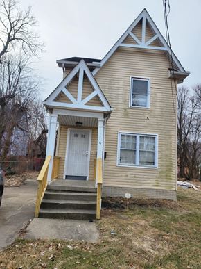 Cleveland house for rent - A small house with a white door and a window.