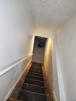 Cleveland house for rent - A stairway with a light at the top.