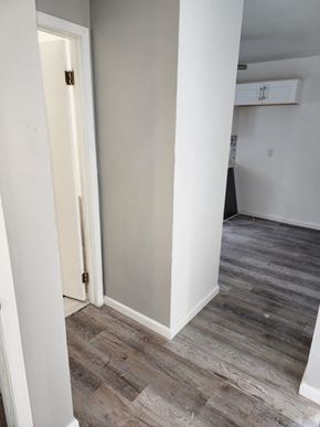 Cleveland house for rent - A white door is open to a room with wood flooring.