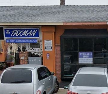 San Diego apartment for rent - A small building with a sign that says "The Taxman" on it.