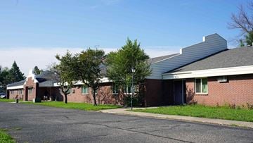 St. Joseph apartment for rent - A building with a red brick exterior and a white roof.