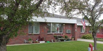 St Cloud apartment for rent - A red brick house with a flag on the front.