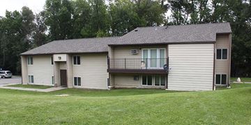 St Cloud apartment for rent - A two-story house with a balcony on the upper floor.