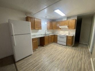 Anchorage apartment for rent - A kitchen with white appliances and wooden cabinets.