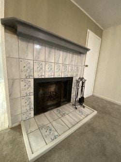 Anchorage apartment for rent - A fireplace with a white tile surround and a black fire place.
