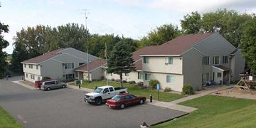 St Cloud apartment for rent - A residential area with houses and cars parked on the street.