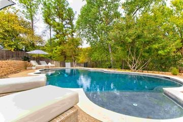Kennedale house for rent - A small pool surrounded by trees and a fence.