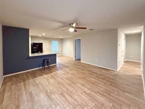 San Antonio house for rent - A room with a ceiling fan and a bar stool.