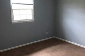 Monroe apartment for rent - A room with a window and carpeted floor.