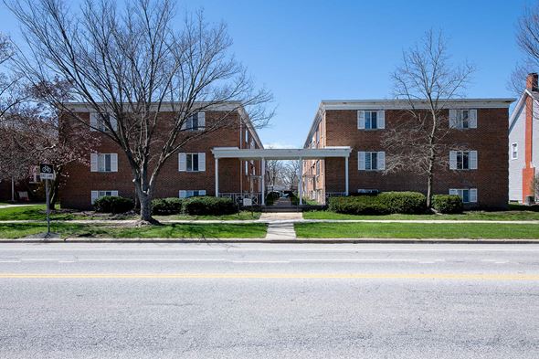 Berea apartment for rent - A large brick building with a white doorway connecting two wings.
