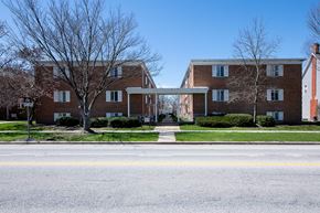 Berea apartment for rent - A large brick building with a white doorway connecting two wings.