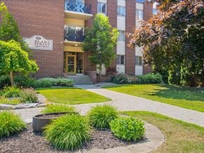 Barrie apartment for rent - A brick building with a sign that says Blake Street.